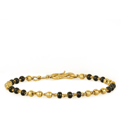 22ct Gold Baby Bracelet with Black Bead Accents 22ct Gold Baby Bracelet with Black Bead Accents
