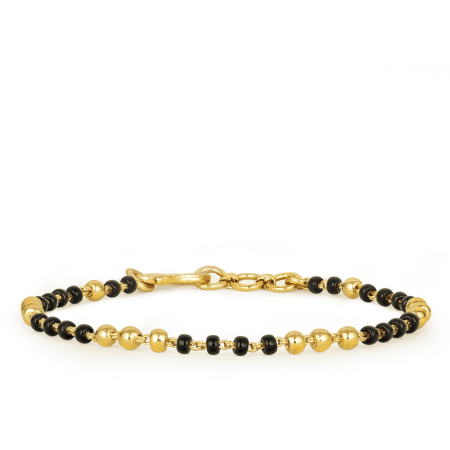 22ct Gold Baby Bracelet with Black Bead Accents 22ct Gold Baby Bracelet with Black Bead Accents