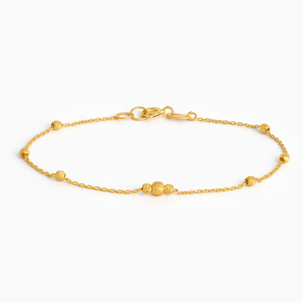 سوار من الذهب عيار 22 قيراط ذهبي مزخرف بسلسلة خرز سوار من الذهب عيار 22 قيراط ذهبي مزخرف بسلسلة خرز